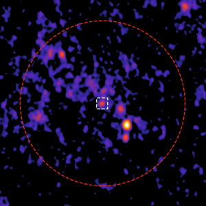 A bright orange point glows in the middle of a field of mottled purple and black, with a red dotted line circling the middle of the image