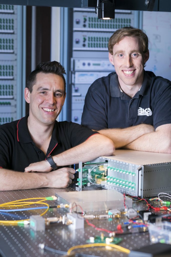 Sascha Schediwy and David Gozzard with a prototype of their SKA-mid Transmitter Module and Sub-Rack enclosure. Credit: ICRAR.
