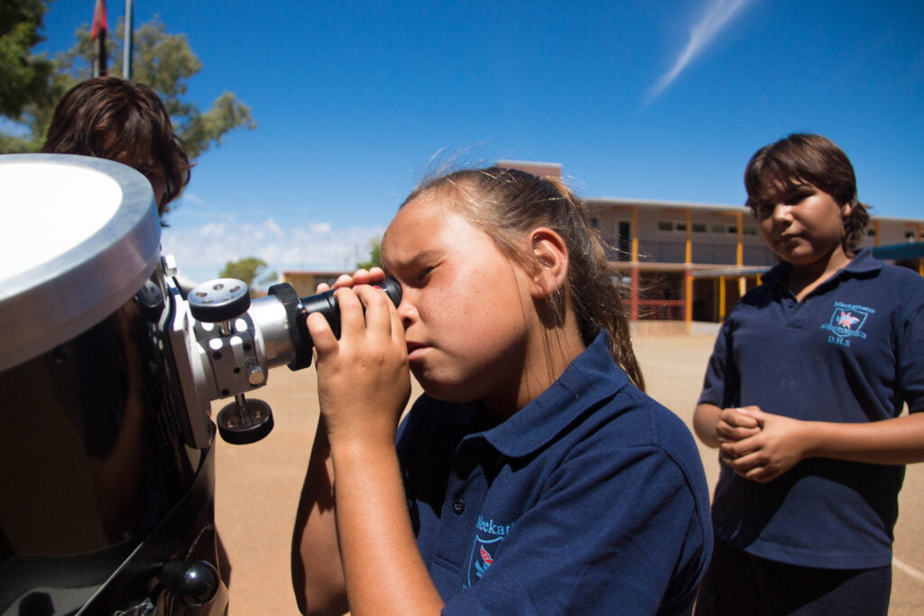 Students at Meekatharra DHS observing the Sun through one of ICRAR's outreach telescopes during a tour of schools and communities in the Mid West.