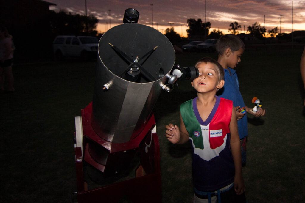 A young mind exploring the sky above at one of ICRAR's community events.