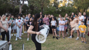 Participants and their families learn how telescopes work.